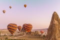 Colourful hot air balloons launching at sunrise in Cappadocia