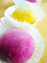 Colourful Japanese Mochi in a transparent plate.