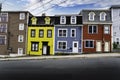 Colourful Jelly bean homes painted in different colours at a harbour city in Atlantic Canada.