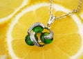 Colourful jewellery pendant with gems and diamonds on lemon back