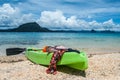 Colourful kayak on the beach. Sea, islands and beautiful clouds on the background Royalty Free Stock Photo