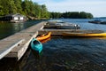 Colourful kayaks and canoes parked at the dock.