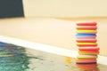 Colourful kids toys by the side of swimming pool Royalty Free Stock Photo