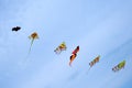 Colourful kites flying high on a blue sky background Royalty Free Stock Photo