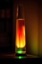 Colourful lava lamp on table in dark room at night, created using generative ai technology