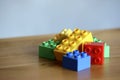 Colourful lego bricks on wooden background