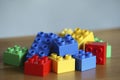 Colourful lego bricks on wooden background