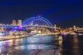 Colourful Light show at night on Sydney Harbour NSW Australia. The bridge illuminated with lasers and neon coloured lights Royalty Free Stock Photo