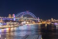 Colourful Light show at night on Sydney Harbour NSW Australia. The bridge illuminated with lasers and neon coloured lights