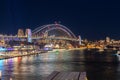 Colourful Light show at night on Sydney Harbour NSW Australia. The bridge illuminated with lasers and neon coloured lights Royalty Free Stock Photo