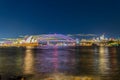Colourful Light show at night on Sydney Harbour NSW Australia. The bridge illuminated with lasers and neon coloured lights Royalty Free Stock Photo