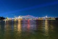 Colourful Light show at night on Sydney Harbour NSW Australia. The bridge illuminated with lasers and neon coloured lights