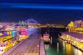 Colourful Light show at night on Sydney Harbour NSW Australia. The bridge illuminated with lasers and neon coloured lights