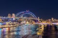 Colourful Light show at night on Sydney Harbour NSW Australia. The bridge illuminated with lasers and neon coloured lights Royalty Free Stock Photo