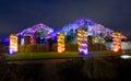 Colourful lights illuminate the glasshouse at Wisley, Surrey.