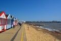 Colourful line of beach huts and pier