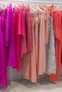 Colourful line of formal dresses on the Aibon stand during Momad 2023 Madrid Spain