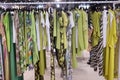 Colourful line of formal green dresses on the Scusi stand during Momad 2023 Madrid Spain