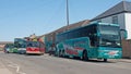 A colourful line-up on Broad Street at Fenland Busfest 2023, Whittlesey, Peterborough, UK