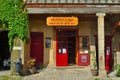 Colourful little wine shop front on the old square at Lagrasse Languedoc France.