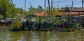 Colourful longtail speed boats ready for tourist trips in the early morning to go out to Phang Nga Bay, Thailand