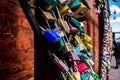 Colourful love locks on a red brick background