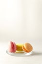 Colourful macaroons on the glass plate close up Royalty Free Stock Photo