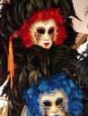 Colourful masks of black red and blue feathers Royalty Free Stock Photo