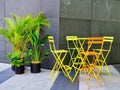 Colourful Metal cafe Chairs and Table in Courtyard