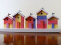 Colourful miniature wooden beach huts Royalty Free Stock Photo