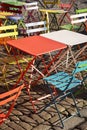 Colourful modern trendy tables and chairs at street cafe