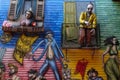 Colourful murial with fibreglass figures mounted on balconies at La Boca, Buenos Aires, Argentina