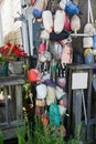 Colourful old fishing floats and buoys strung along a boatyard wall Royalty Free Stock Photo