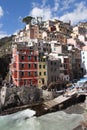 Colourful old houses, dock and boats in Riomaggiore fisherman village, Cinque Terre, Liguria, Italy Royalty Free Stock Photo