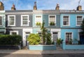 Colourful Old Terraced Houses with Wooden Front Doors on a Sunny Day Royalty Free Stock Photo