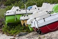 Colourful paddle-boats on a beach