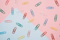 Colourful paper clips on colourful pastel colour background