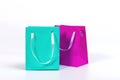 Two colourful paper shopping bags isolated on white background, mockup for design Royalty Free Stock Photo