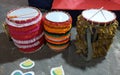 colourful percussion drum or dhol on art decorated street with sticks ready to celebrate kali puja.