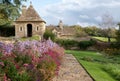 Colourful Michaelmas daisies in the garden at Great Chalfield Manor near Bradford on Avon, Wiltshire UK, photographed in autumn. Royalty Free Stock Photo