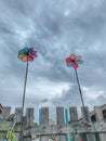 Colourful Pinwheels at the old wooden fence