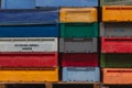 Colourful plastic fish boxes stacked on wooden pallets in the fish market of Sassnitz