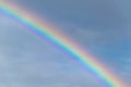 Colourful rainbow formed after a summer shower