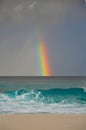 Colourful rainbow over the sea in a tropical beach