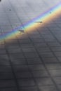 Rainbow reflected on a puddle