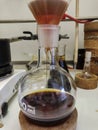 Colourful reaction mixture filtration through the funnel to a round bottom flask