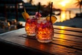 Colourful refreshing cocktails on the wooden table served in beach bar on summer day Royalty Free Stock Photo