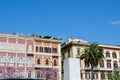 Colourful rich facades built in Italian architectural tradition against clear blue sky in Cagliari, Italy