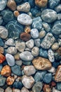 Colourful round sea pebbles in the crystal clear sea. Royalty Free Stock Photo