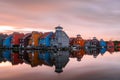 Colourful row houses on pier along a harbour at sunset Royalty Free Stock Photo